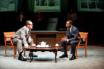 Johnson and King at a coffee table in the Oval Office, meeting over tea.